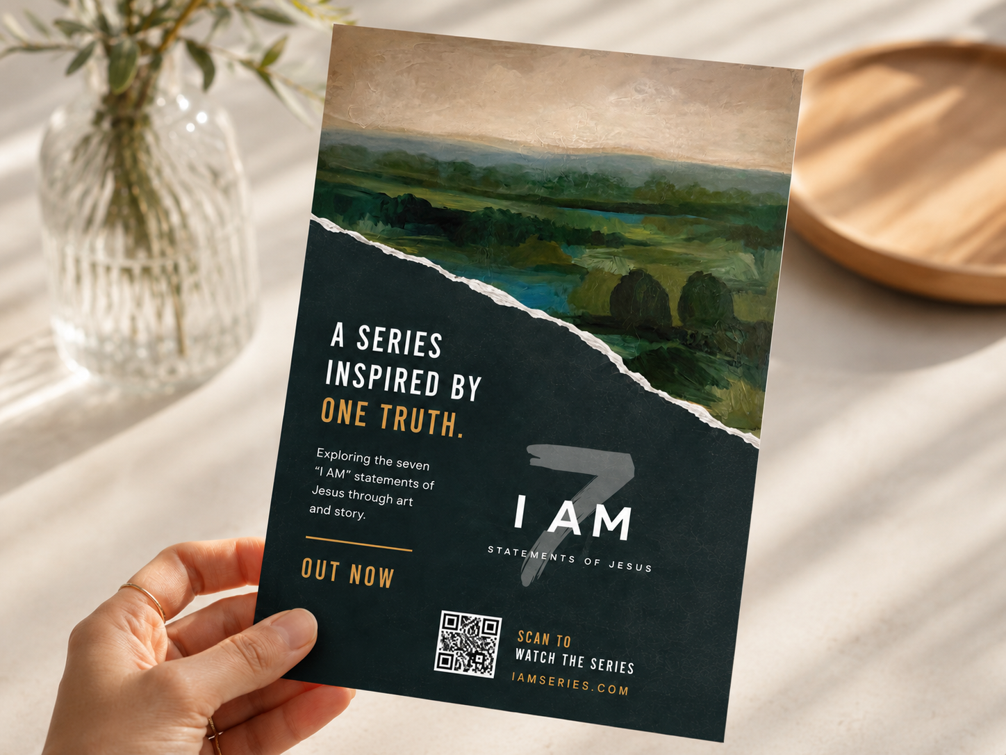 Seven I AM printed invitation flyer held in hand.